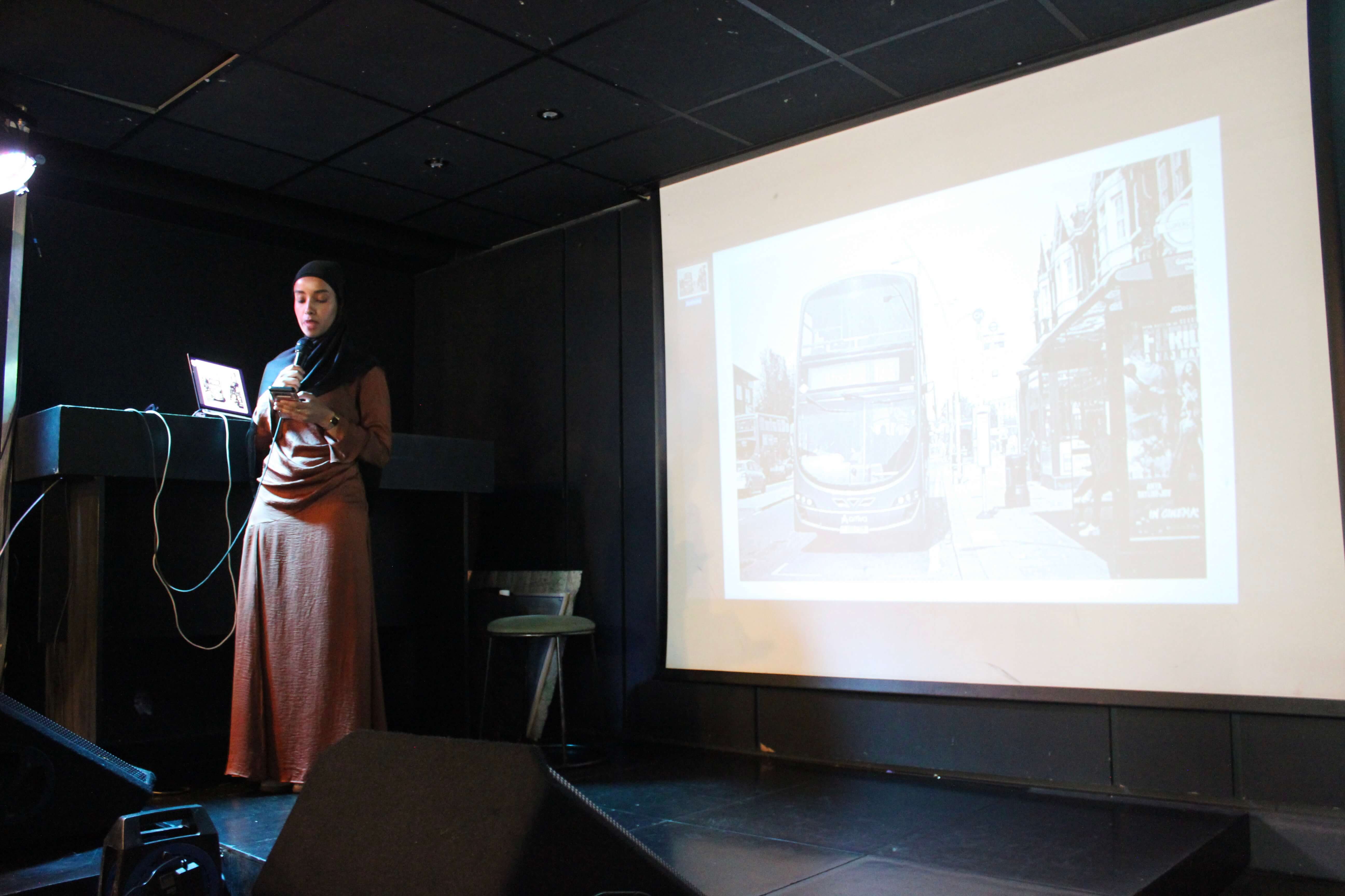 Sahra Abdulrehman talking on stage.